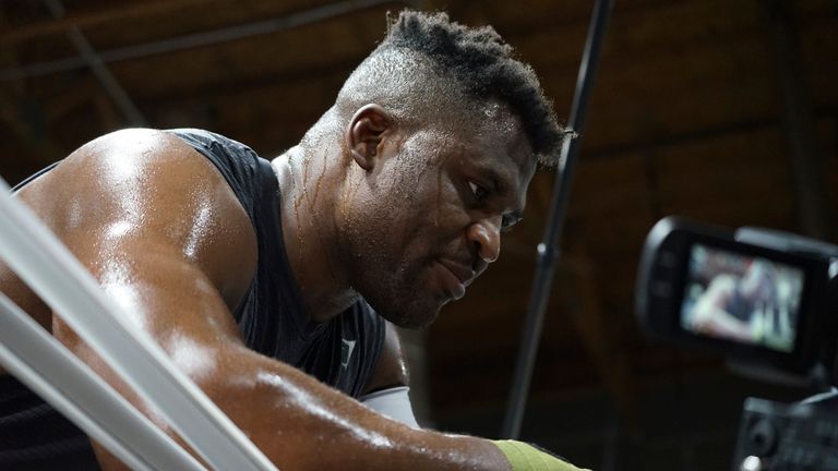 LAS VEGAS, NV - SEPTEMBER 26: Francis Ngannou trains with coaches Mike Tyson and Dewey Cooper at the Tyson Fury vs. Francis Ngannou open workout on September 26, 2023, at Ngannou's private gym in Las Vegas, NV. (Photo by Amy Kaplan/Icon Sportswire) (Icon Sportswire via AP Images)


