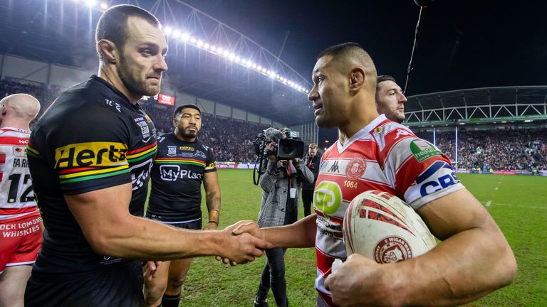 Picture by Allan McKenzie/SWpix.com - 24/02/2024 - Rugby League - Betfred World Club Challenge - Wigan Warriors v Penrith Panthers - DW Stadium, Wigan, England - Penrith's Isaah Yeo shakes hands with Wigan's Willie Isa after the game.