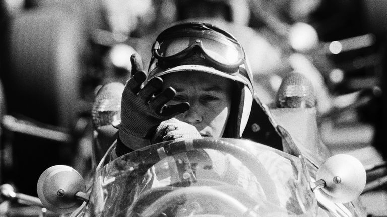 John Surtees, Ferrari 158, pulls on his gloves.