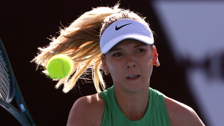 Katie Boulter of Britain plays a forehand return to Zheng Qinwen of China during their second round match at the Australian Open tennis championships at Melbourne Park, Melbourne, Australia, Thursday, Jan. 18, 2024. (AP Photo/Asanka Brendon Ratnayake)