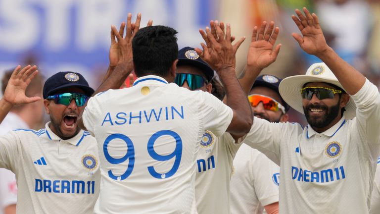 India's Ravichandran Ashwin, his back to the camera, celebrates the wicket of England's Joe Root on the third day of the fourth cricket test match between England and India in Ranchi, India, Sunday, Feb. 25, 2024. (AP Photo/Ajit Solanki)