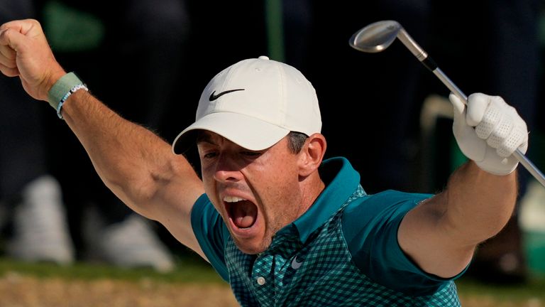 Rory McIlroy, of Northern Ireland, reacts after holing out from the bunker for a birdie during the final round at the Masters golf tournament on Sunday, April 10, 2022, in Augusta, Ga. (AP Photo/Matt Slocum)