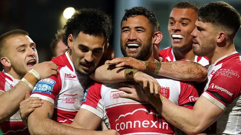 Hull KR's Peta Hiku (centre) celebrates scoring his side's third try against Leeds Rhinos