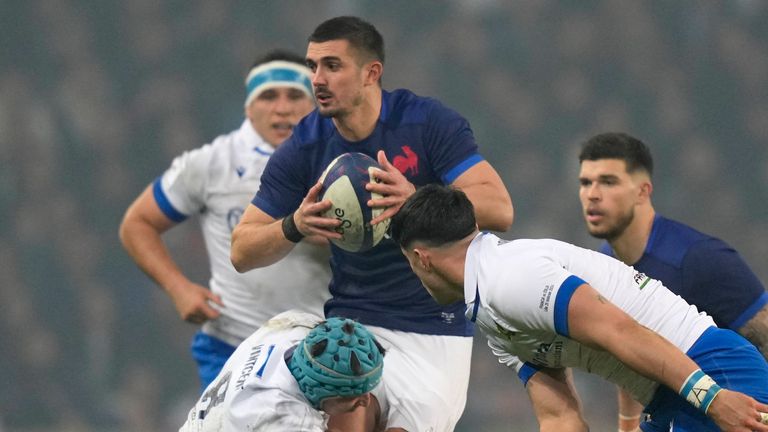 France's Thomas Ramos is brought down. (AP Photo/Lewis Joly)